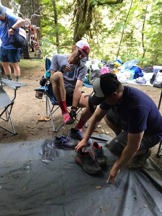 McCathie gets a new pair of shoes at an aid station